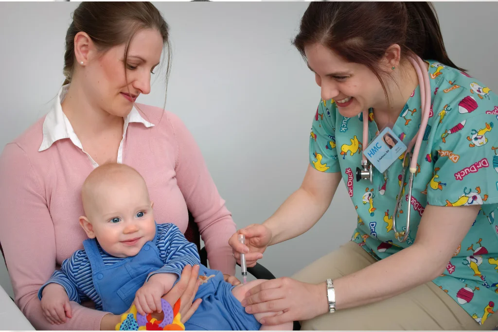 Pediatrician providing care to a young child